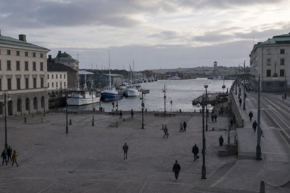 Fishing boats moored in a small Gothenburg archipelago harbour on a grey morning