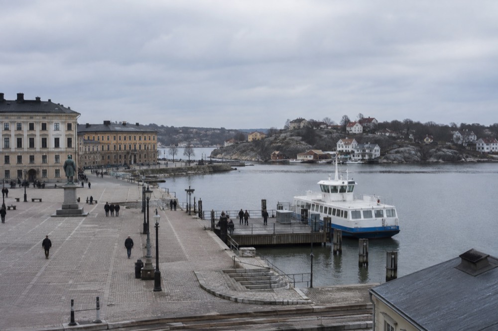 A public ferry moored at a wooden quay on an island in the Gothenburg archipelago