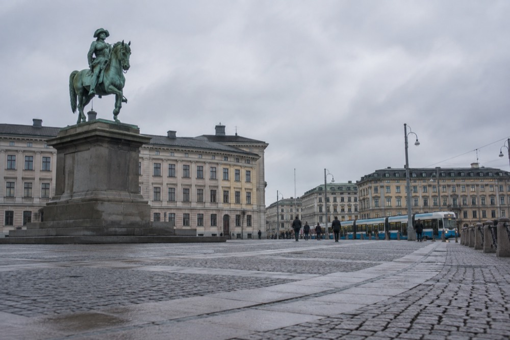 A Swedish high-speed train waiting at a platform beside Gothenburg Centralstation on a grey morning