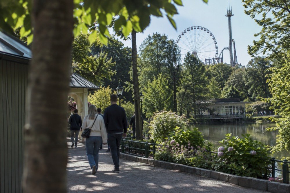 Ferris wheel and amusement rides at Liseberg amusement park in Gothenburg under a daylight sky