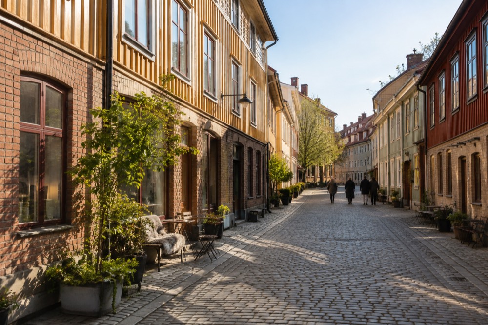 Painted wooden houses on a cobbled street in the Haga district of Gothenburg