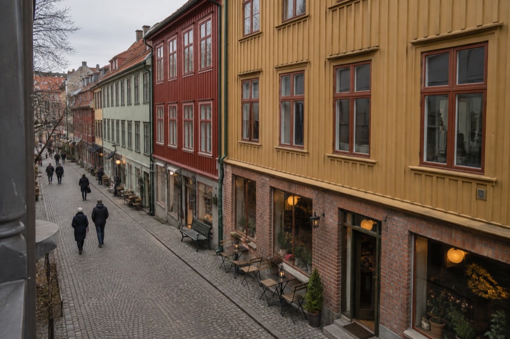 Row of ochre and red landshövdingehus buildings with wooden ground floors on a Haga street