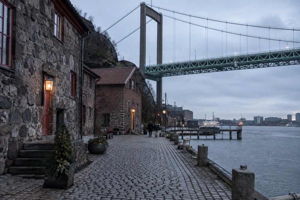 A quiet street of old harbour buildings near Klippan in soft evening light