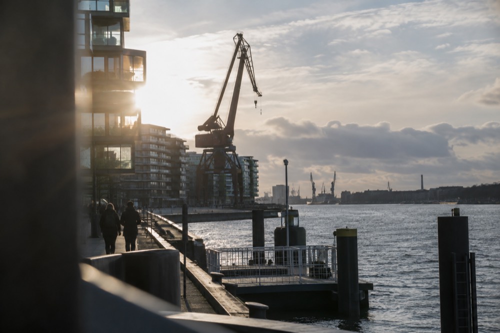Preserved shipyard crane standing among new apartment buildings on the Hisingen waterfront