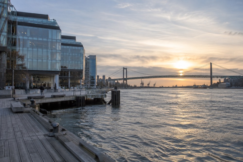 Evening light on the river with the Älvborg bridge and waterfront buildings