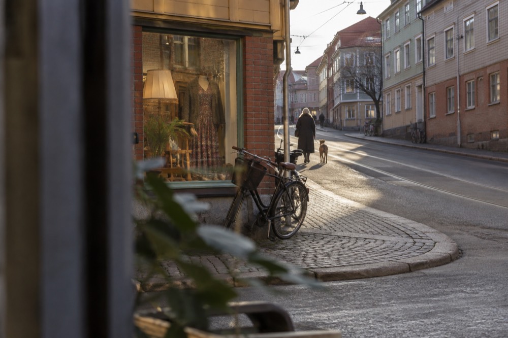 A Majorna street corner with a vintage shop window and bicycles