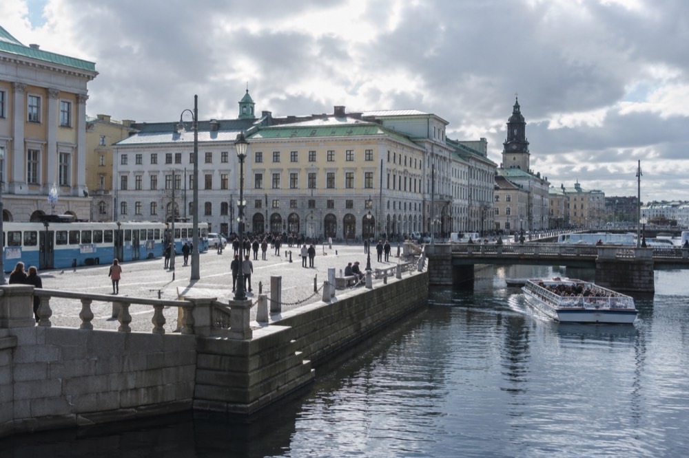 The canal along the old moat in central Gothenburg, with a sightseeing boat passing stone buildings