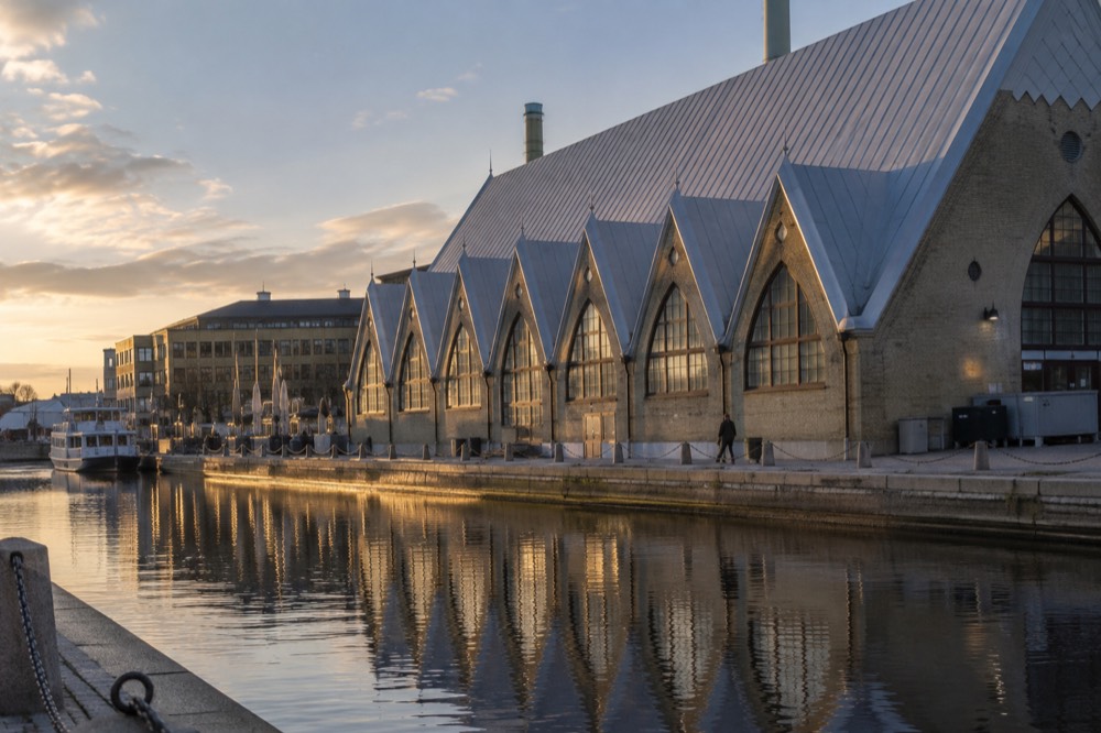 The fish church building Feskekorka with its boat-shaped wooden roof seen from the street