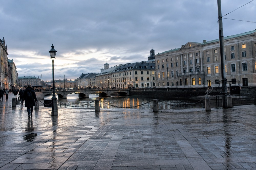 Evening light on the canal beside the museum with the old town rooftops beyond