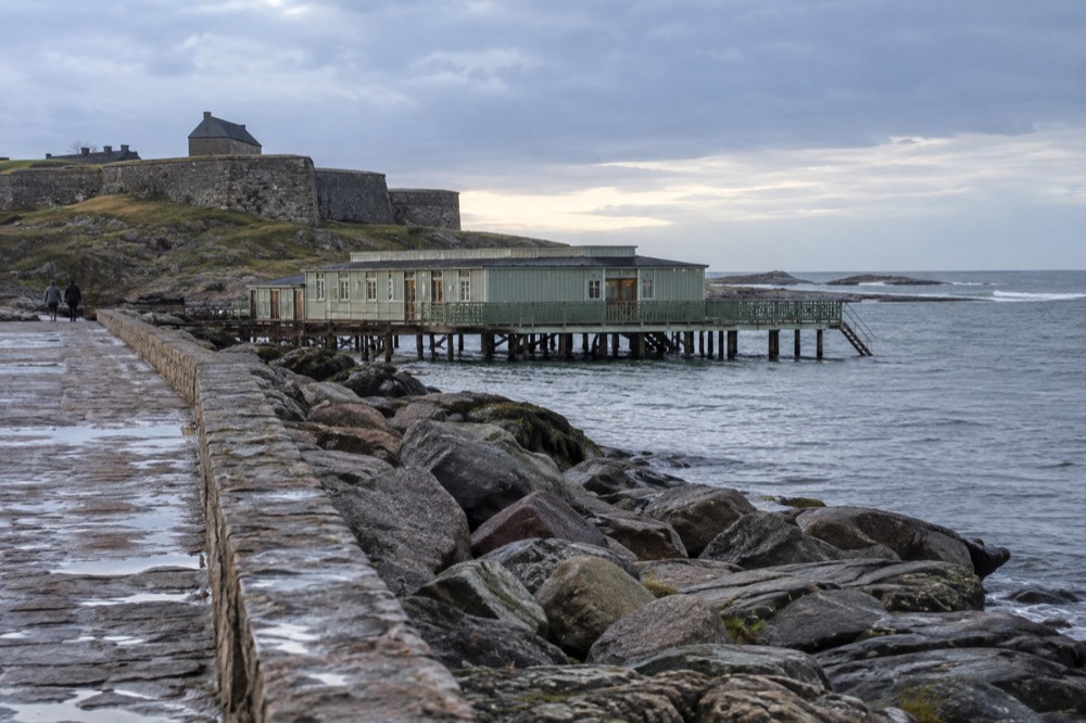 A wooden cold-bath house standing on stilts over the sea at Varberg
