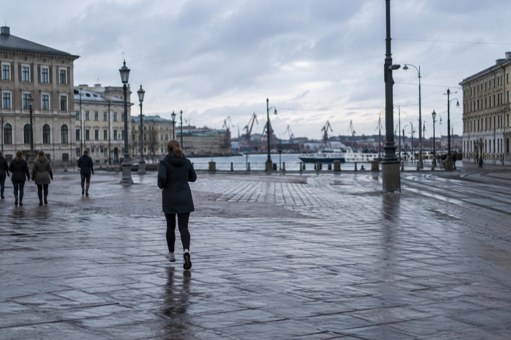 Gothenburg rooftops and harbour cranes under grey Nordic light