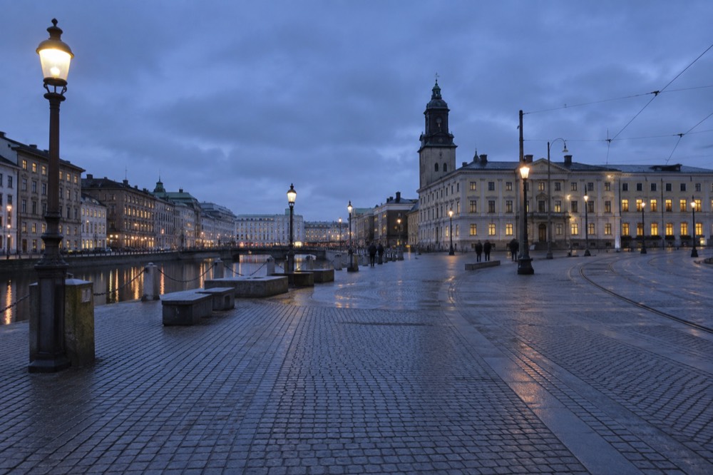 A coastal Swedish town with a stone fortress beside the sea