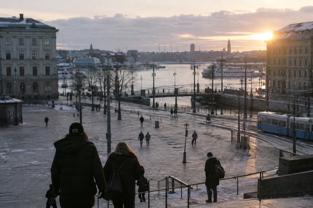 Winter sunrise over the Göta älv in Gothenburg, with pale light on the water and the city skyline