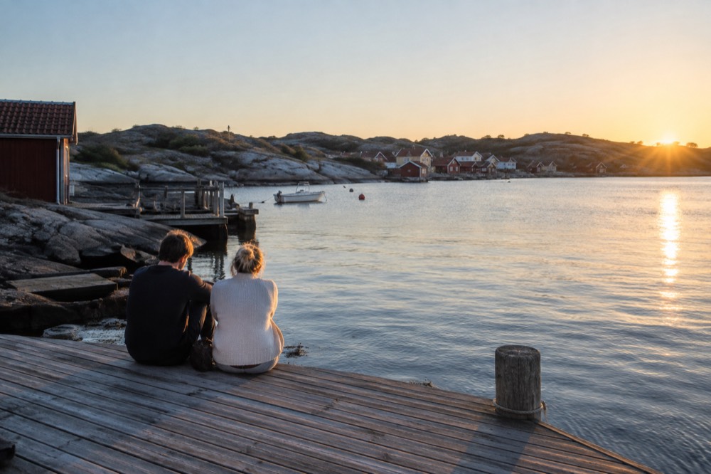 Evening light on a wooden dock on a Gothenburg archipelago island, calm sea and clear sky