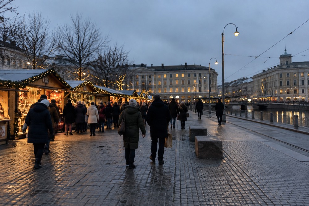 Christmas lights glowing at an outdoor market in Gothenburg at blue hour, crowds in winter coats