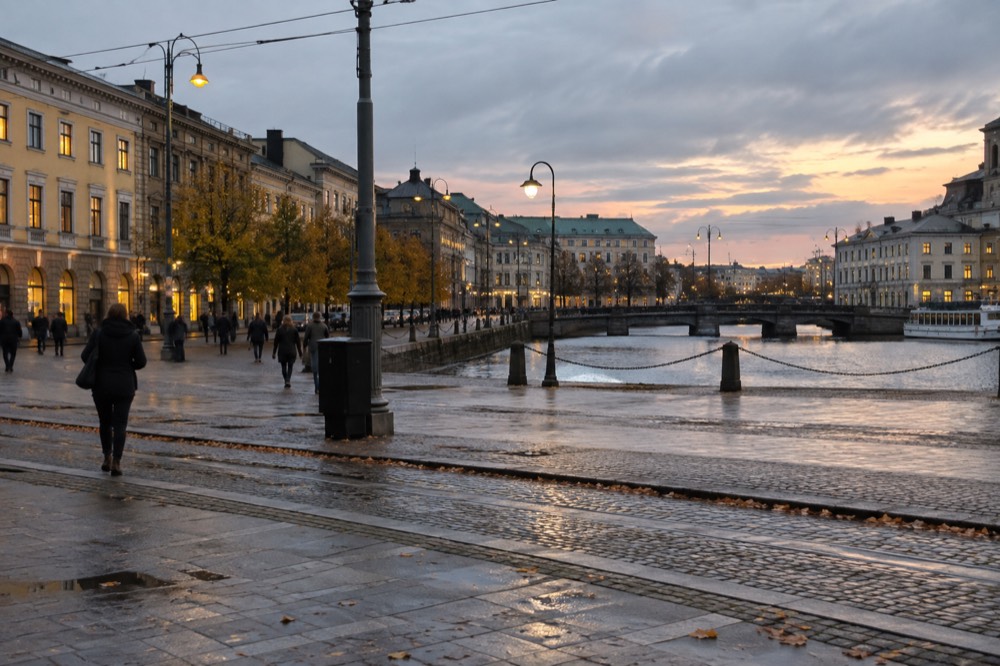 Street lamps and early dusk over a canal in Gothenburg in late autumn
