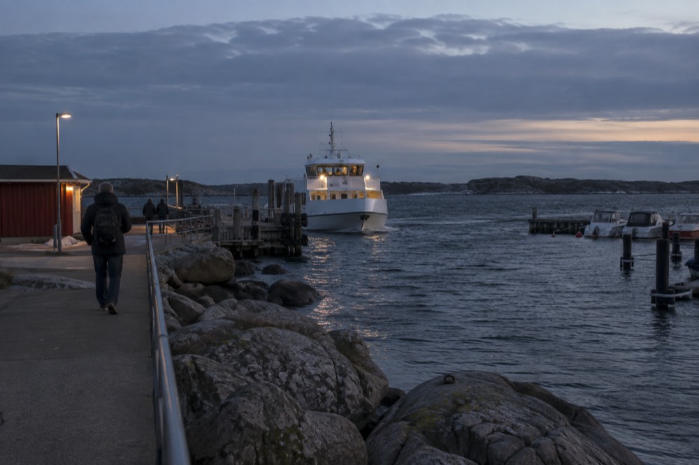 Archipelago ferry approaching a wooden jetty at Saltholmen in Gothenburg