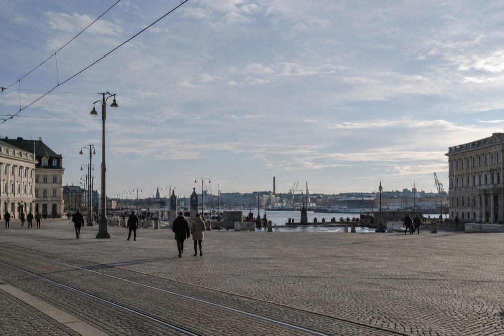 View over Gothenburg rooftops and harbour cranes from a hilltop viewpoint