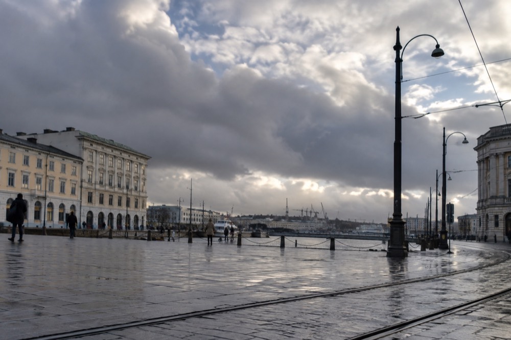 Rain clouds breaking over the Göta älv river and harbour cranes