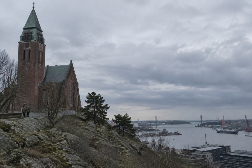 View over the Göta älv river, harbour cranes and the Älvsborg Bridge from the Masthuggskyrkan terrace