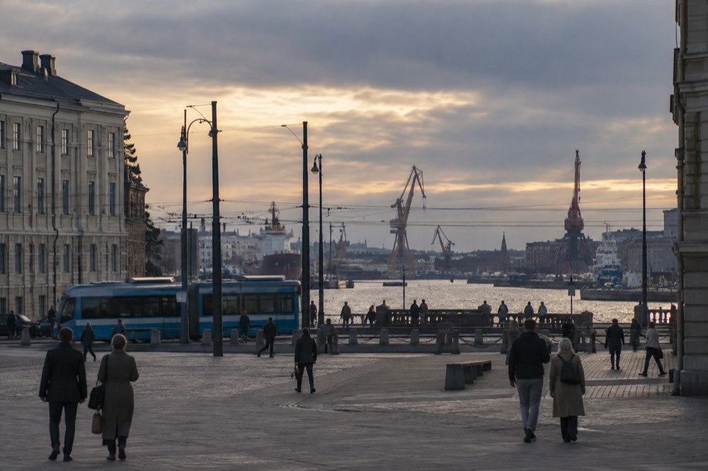 Evening light over rooftops and harbour cranes in central Gothenburg