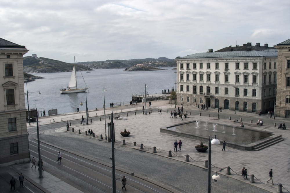 A sailing boat passing islands in the Gothenburg archipelago with coffee and buns served on deck