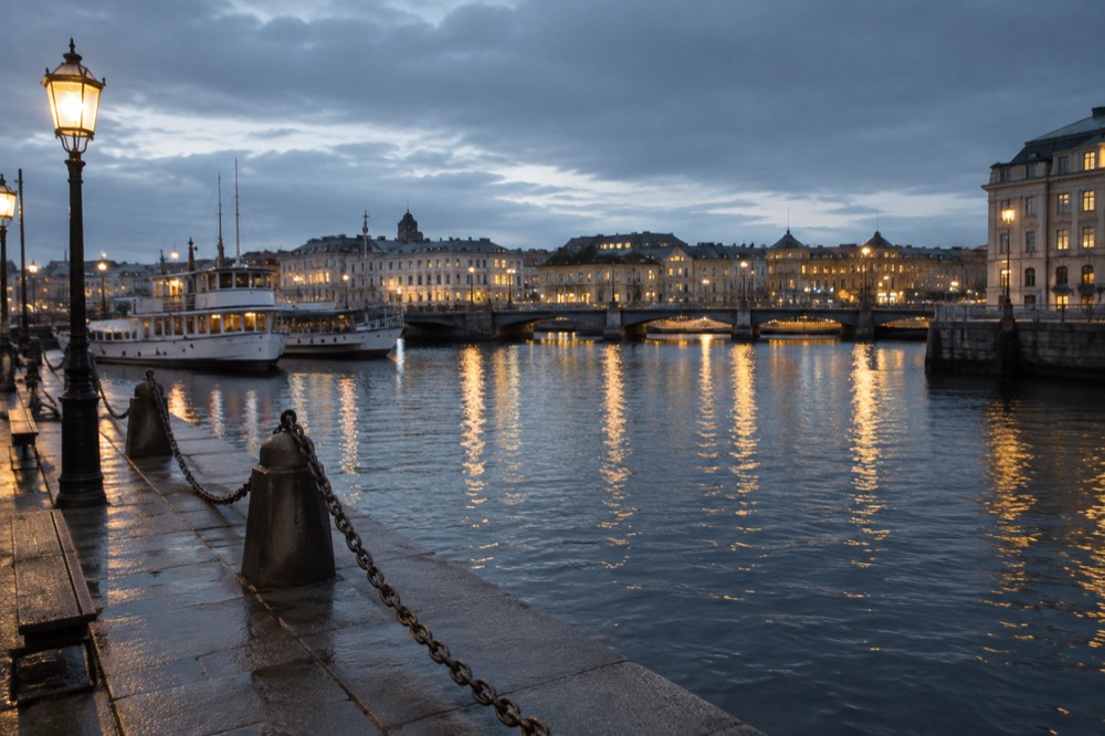 Evening harbour in Gothenburg with bridge lights reflecting on dark water
