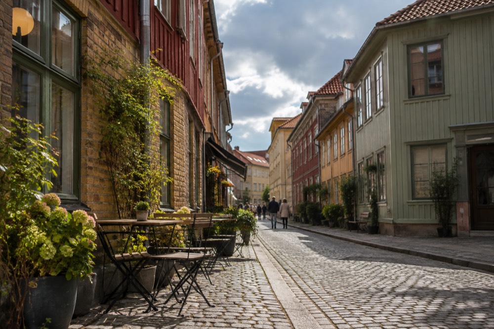 Cobbled street with painted wooden houses in Haga old quarter